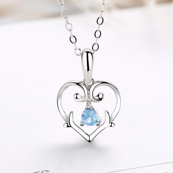 Heart - Shaped Silver Necklace with Blue Gem
